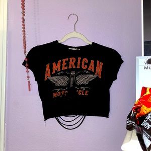 A grungy black ripped American motorcycle crop top.
